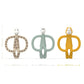 Three animal ring teethers with faces: spotted, mint, and yellow—measures shown