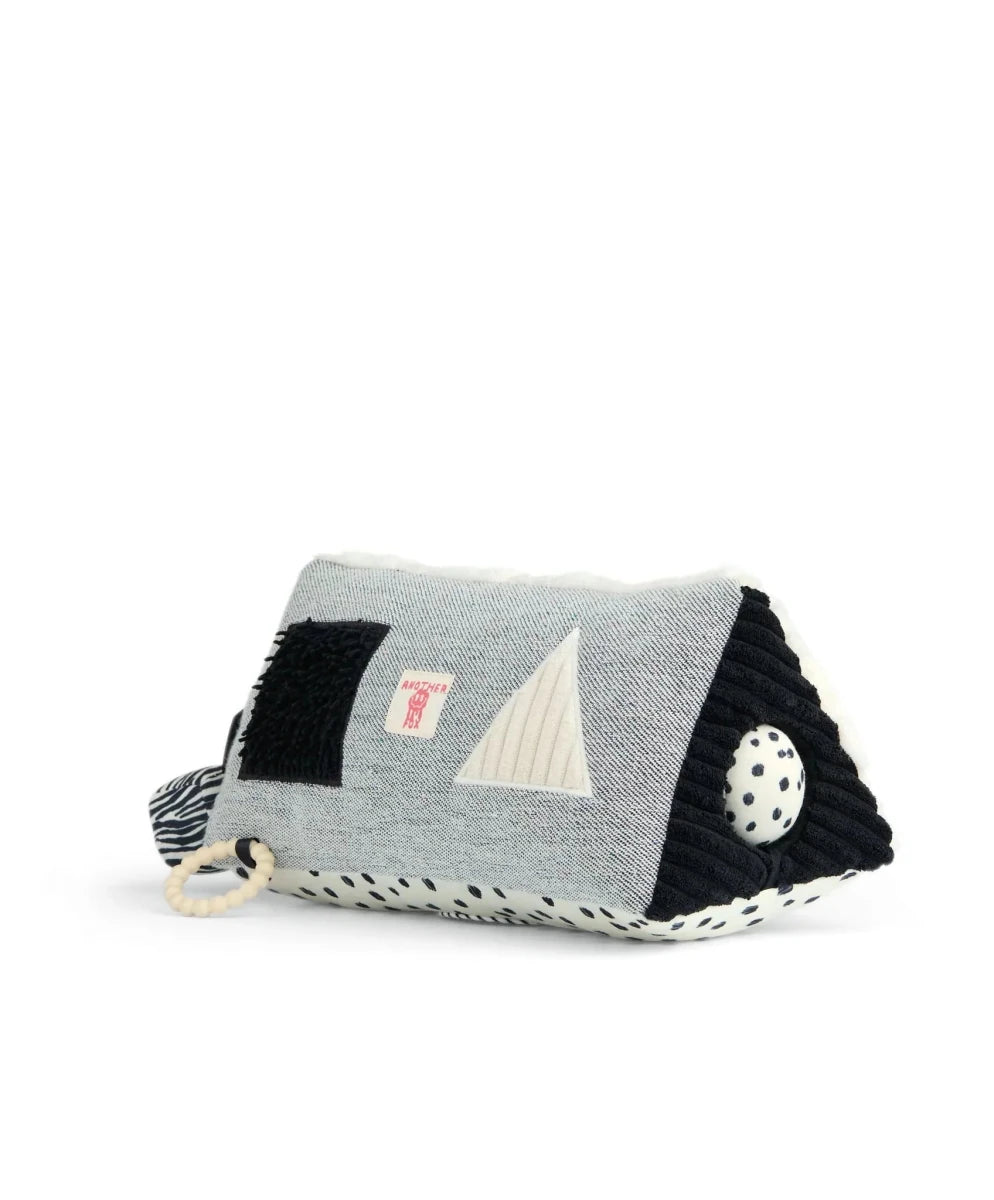 Fox activity triangle toy pillow in gray with black panel and corner attachments