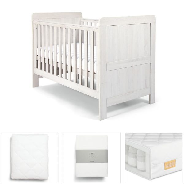 Cotbed with white quilted mattress protector fitted on top