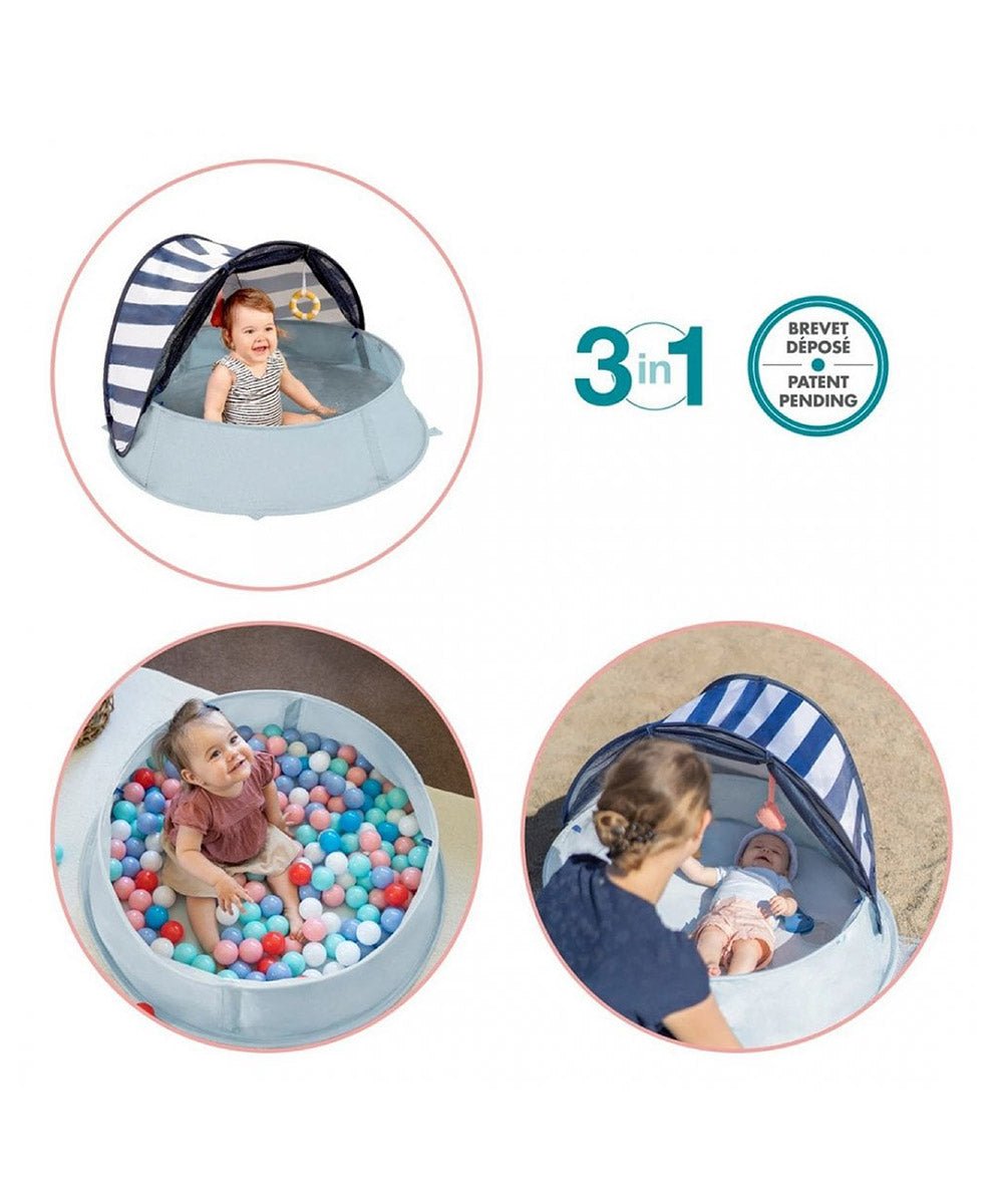 Light blue pop-up baby play tent with striped canopy and carrying bag set