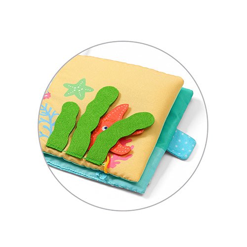 Soft sensory sea-themed fabric book with applique starfish, kelp, and fish on cover