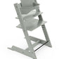 Light gray baby high chair set with seat and back cushion on wooden frame