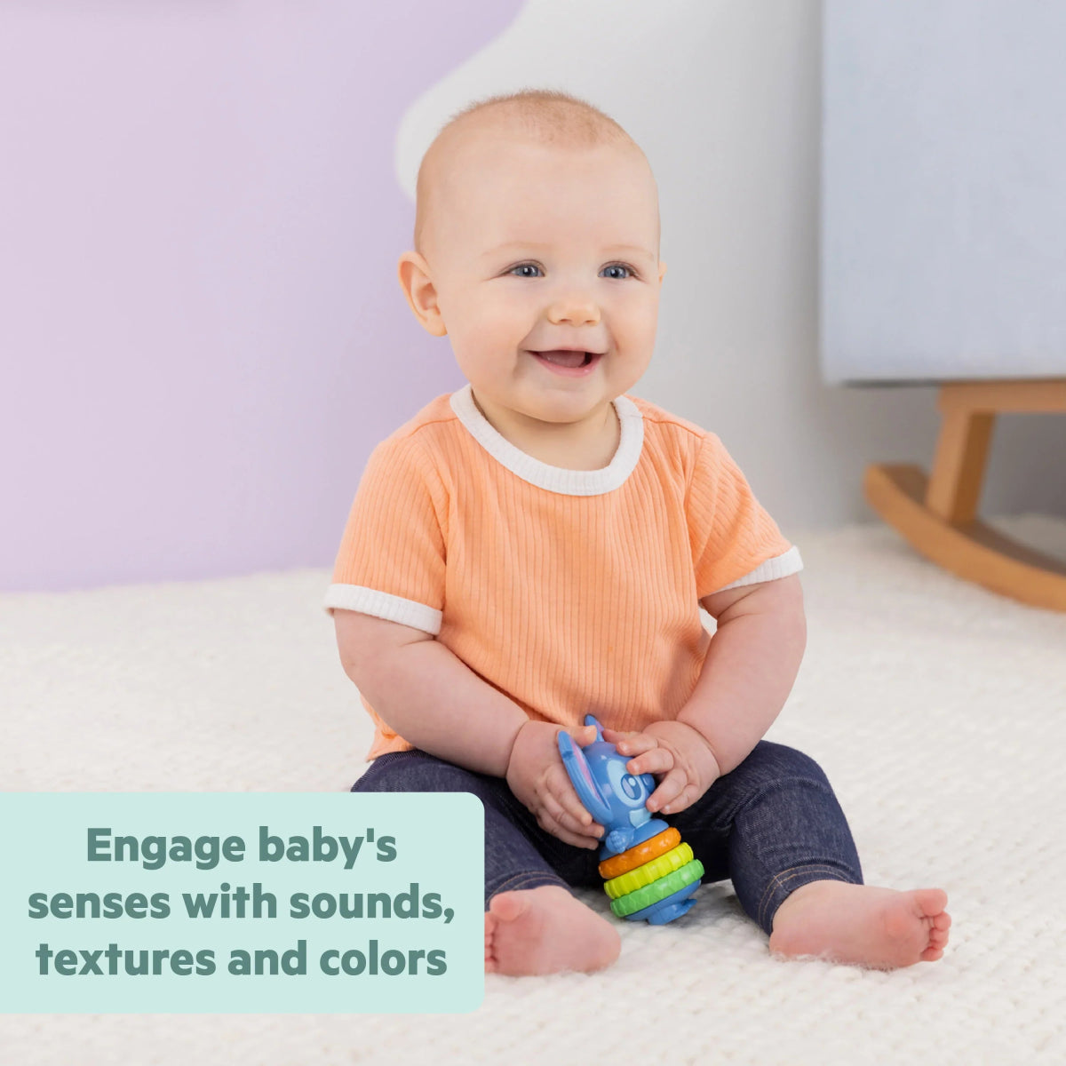 Blue baby fidget toy with stacked rainbow rings in a small handheld design