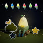 Silicone nightlight with pear-shaped character, white face and green knitted outfit