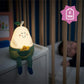 Pear-shaped silicone nightlight in green knit with yellow chick and small leaf top
