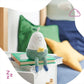 Silicone nightlight pear character, closed-eye face on green knit with yellow chick