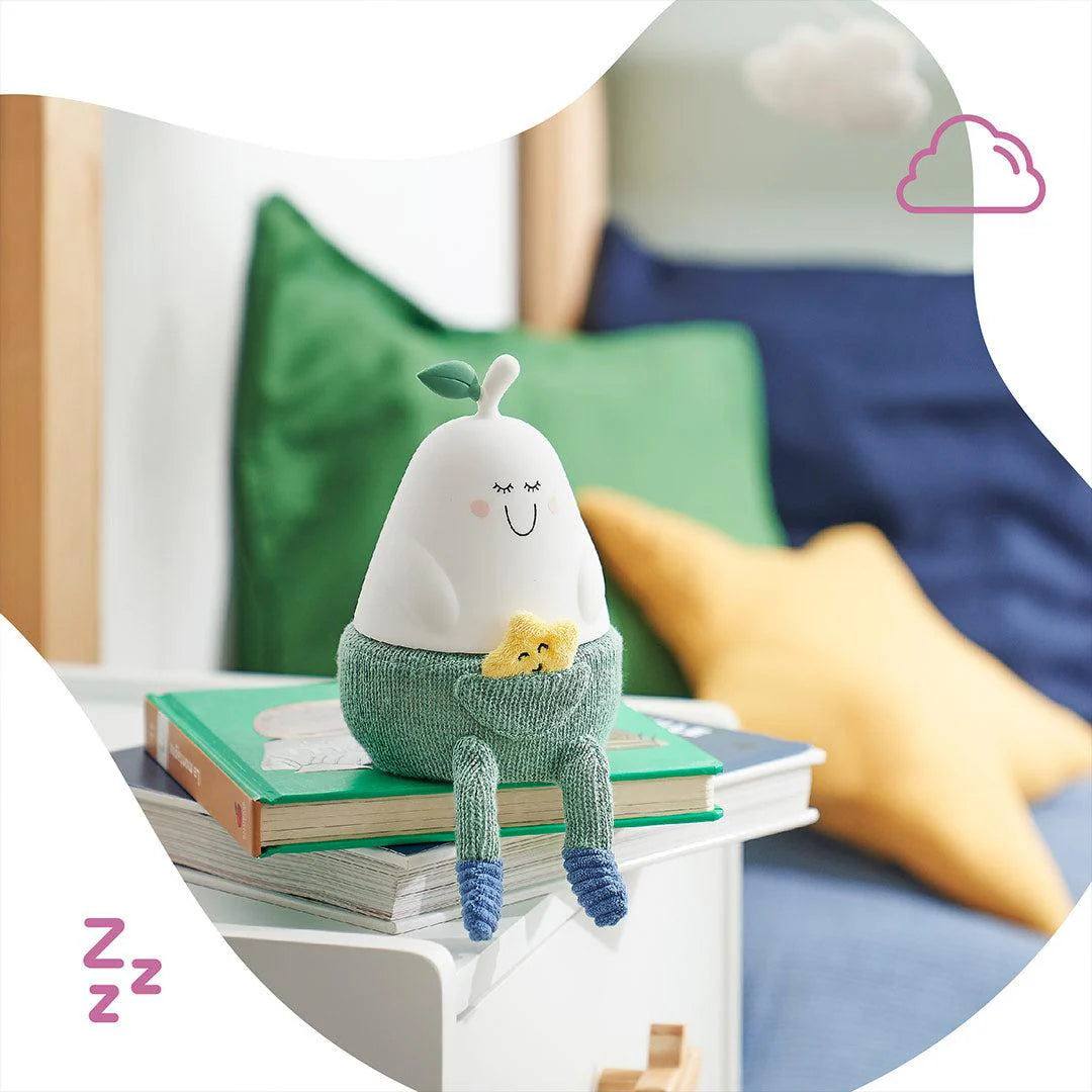 Silicone nightlight pear character, closed-eye face on green knit with yellow chick