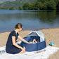 Navy baby pop-up play tent with open mesh canopy and baby inside