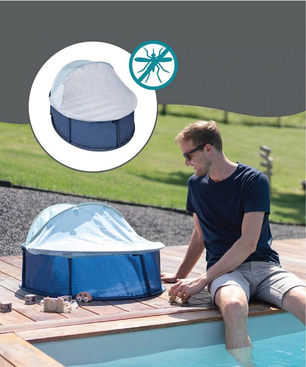 Navy pop-up baby tent with light mesh canopy set up for use