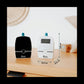 Babyphone monitor units on a table, showing size measurements and LCD screens