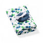 Bamboo muslin swaddle blanket, white with blue blueberry fruit print, folded with bow