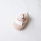 Pink bath boat with white toilet seat and smiling monkey bath toy