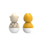 Two animal bath wobblers from the back: yellow lion and spotted white giraffe