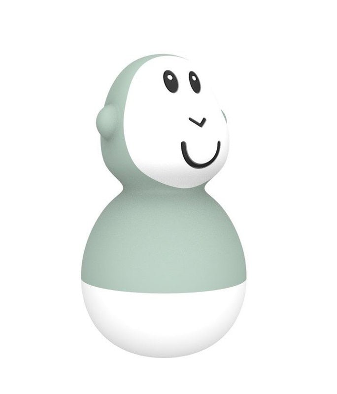 Single mint bath wobbler toy with smiling face, black eyes, and white bottom.