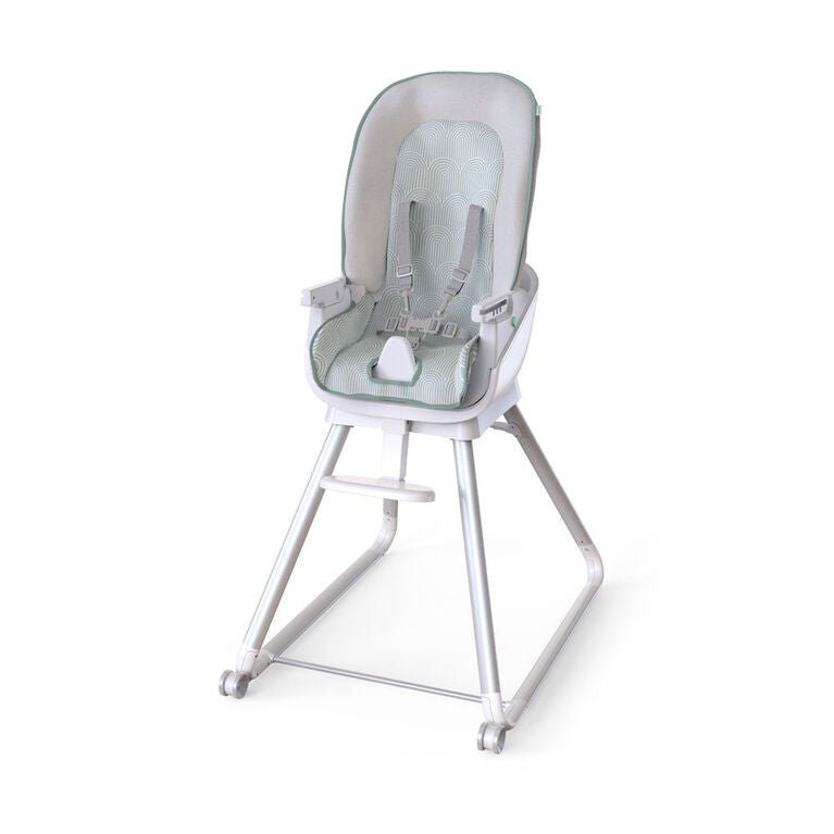 Gray high chair with padded insert, clear tray, and visible harness straps
