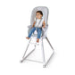 Gray high chair with clear tray and padded seat, child seated on footrest
