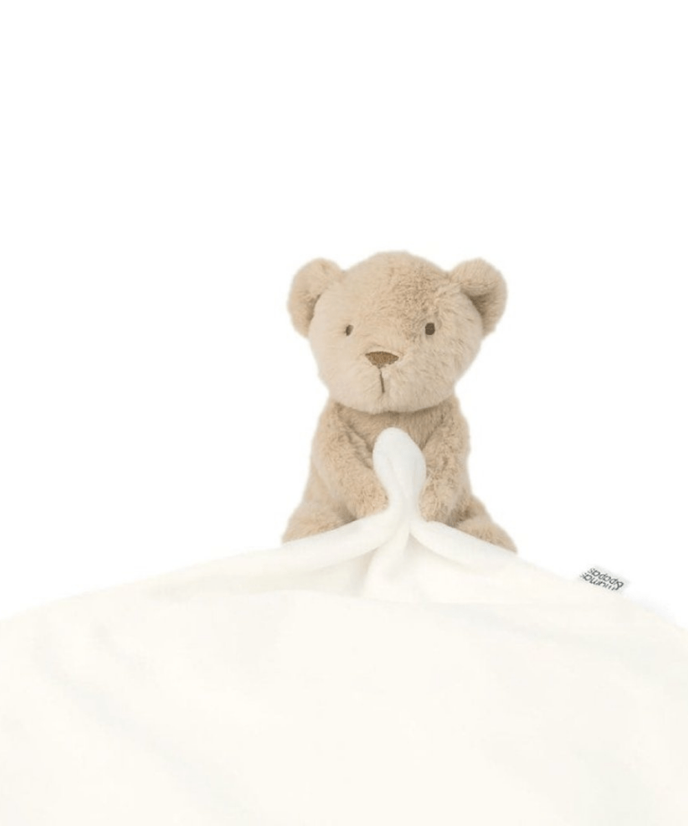 Bear comforter with beige plush bear and white blanket