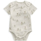White short-sleeve bodysuit with allover teddy animal print and snap closure