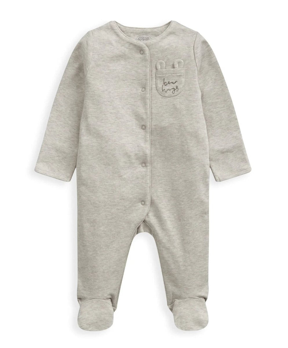 Gray knit footed sleeper with front snap buttons and small chest graphic