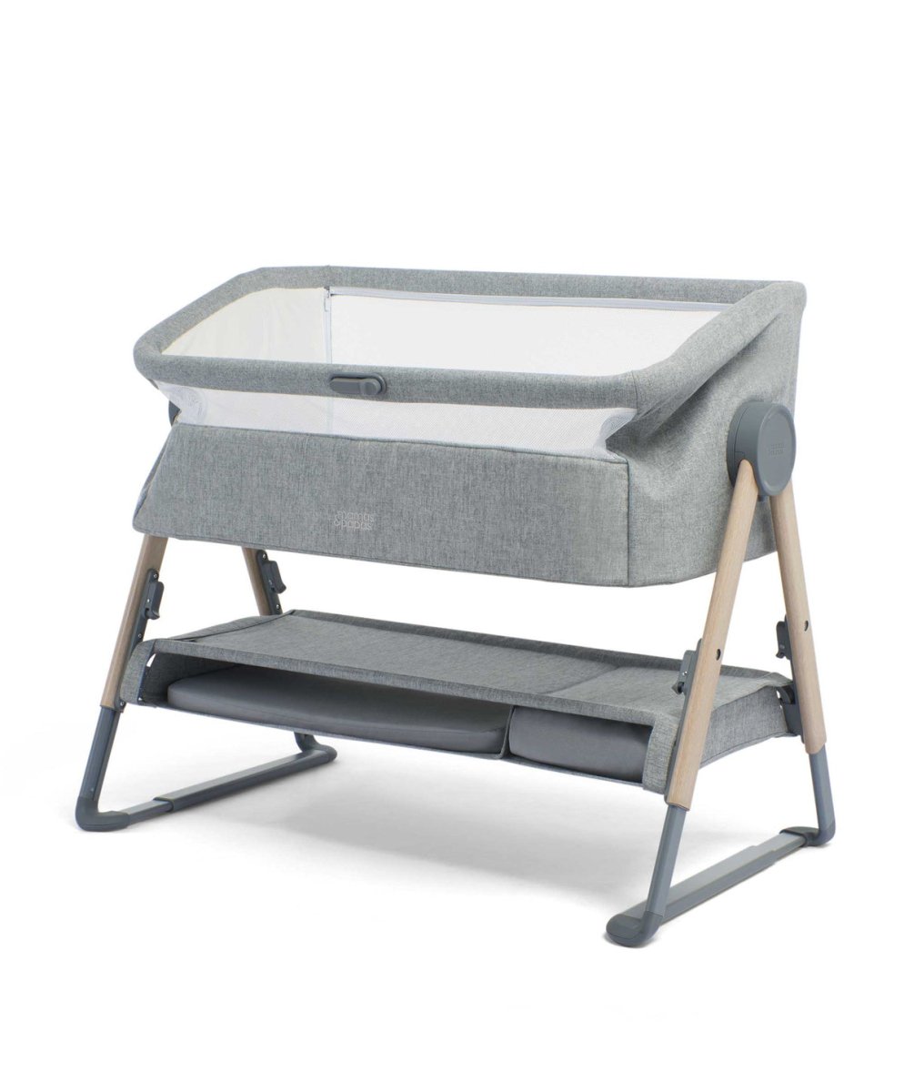 Grey bedside crib with fabric frame, open side and bassinet surface