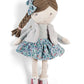 Rag doll with braided brown hair, blue bow, gray jacket, floral skirt, pink shoes