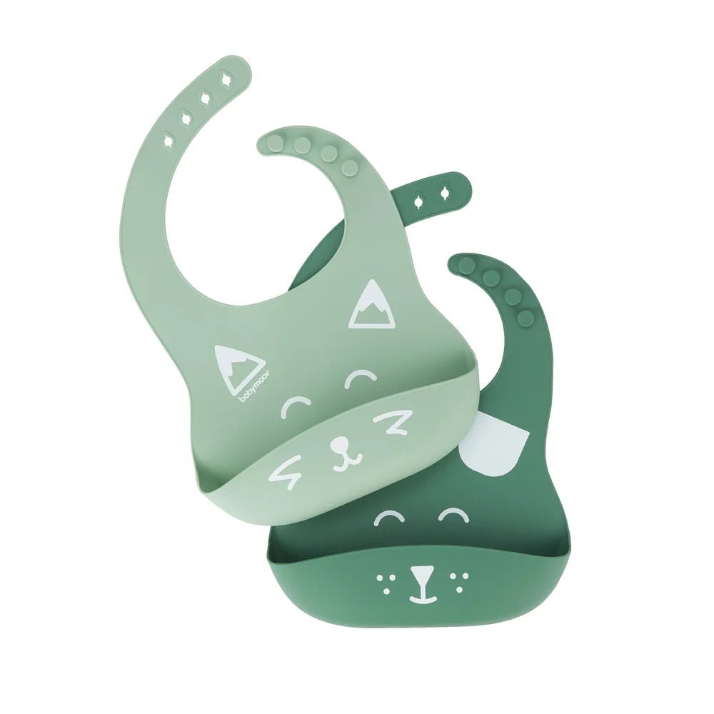 Green silicone bib with front pocket, molded silicone texture and icon print