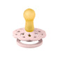 Pacifier with yellow nipple and pink round floral shield, with gold center ring