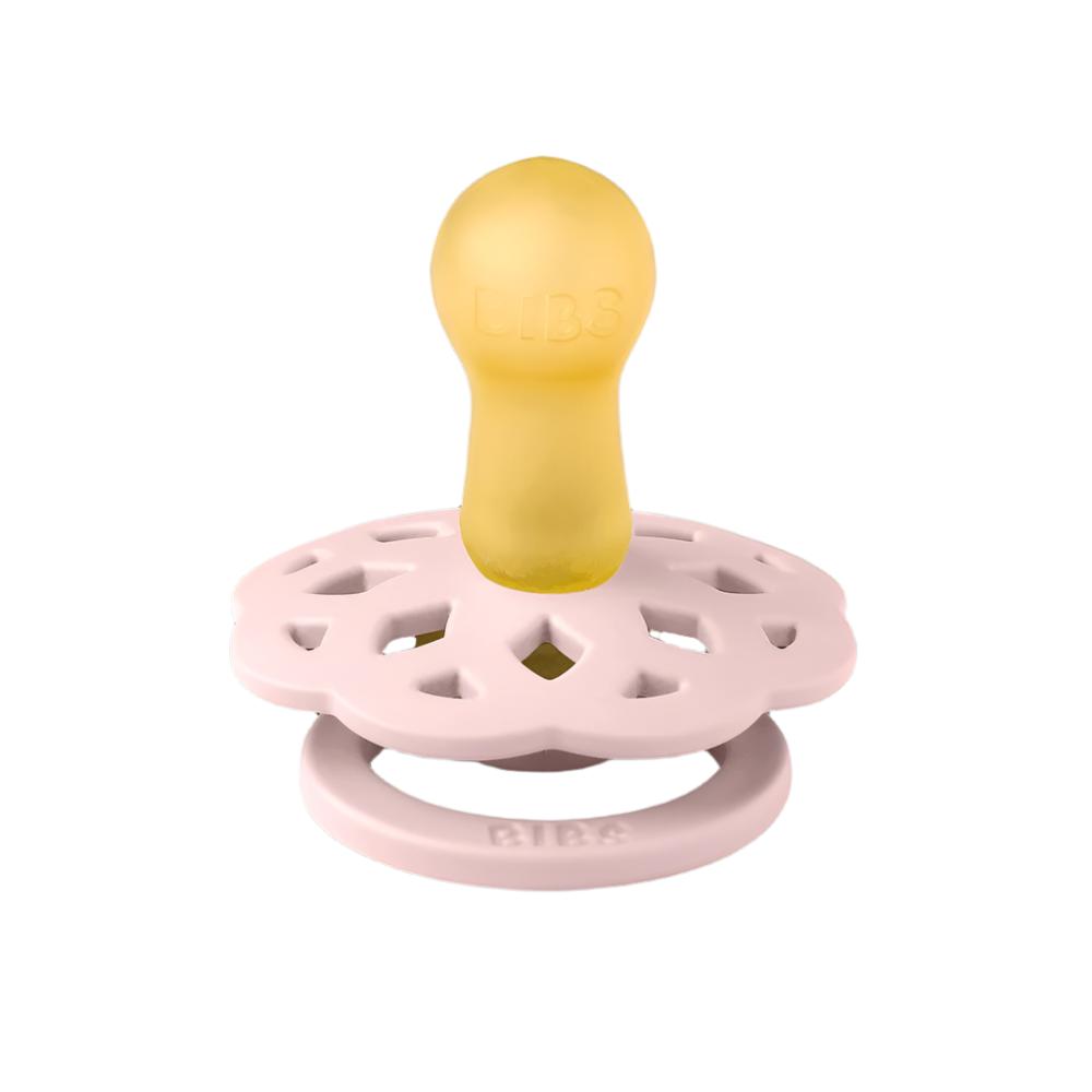Pacifier with yellow nipple and pink round floral shield, with gold center ring