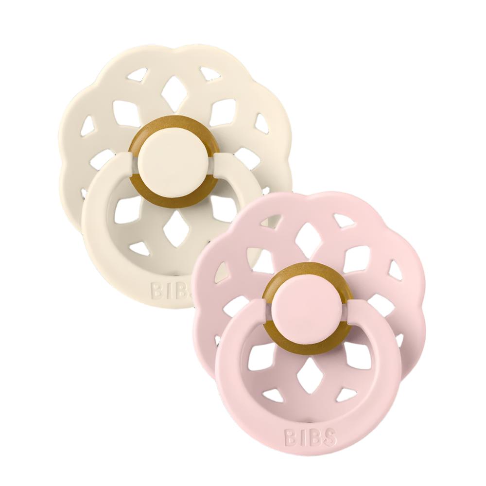 Pair of flower pacifiers in ivory and pink with gold center rings and BIBS text