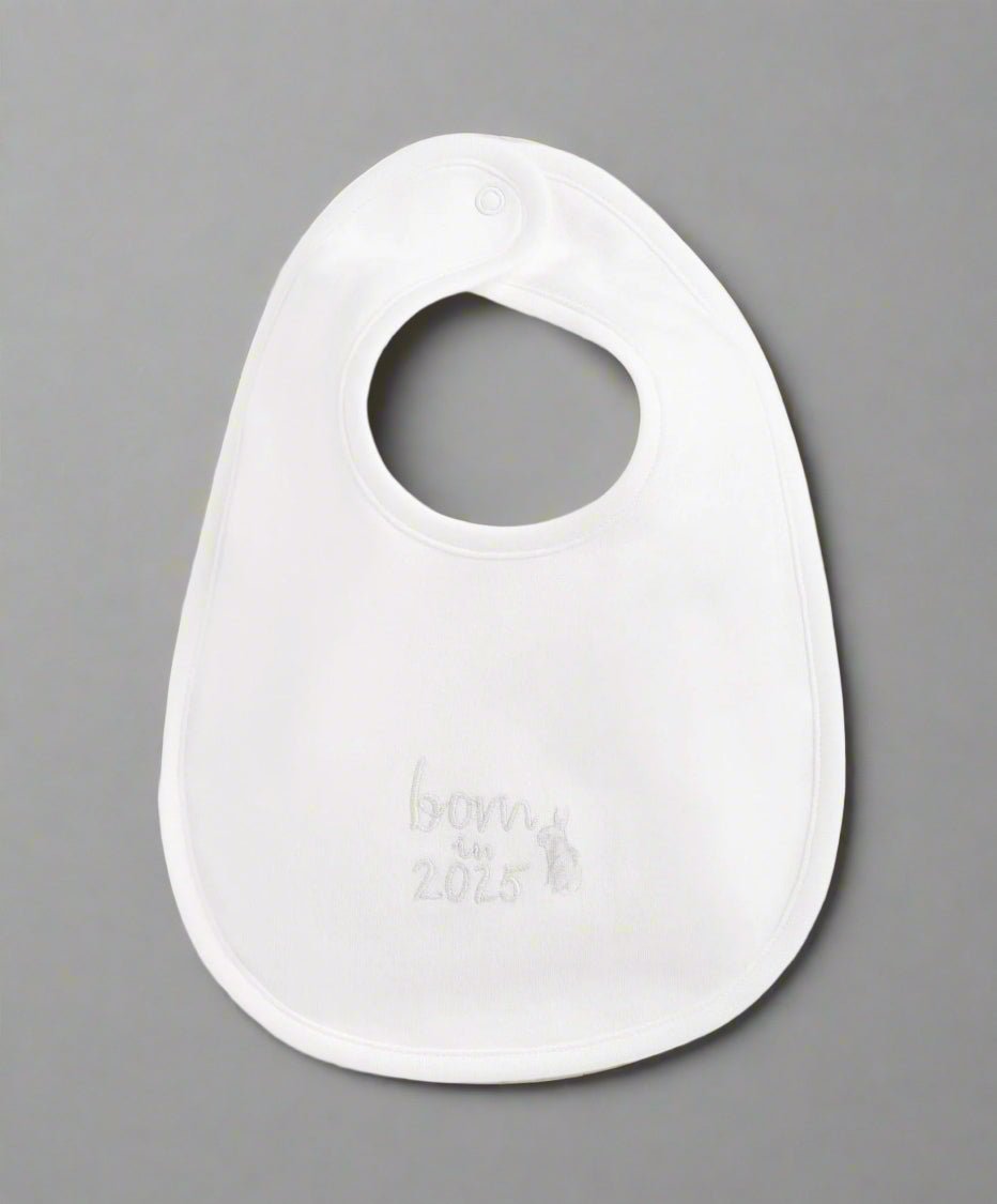 White baby bib with embroidered “Born 2025” text at center
