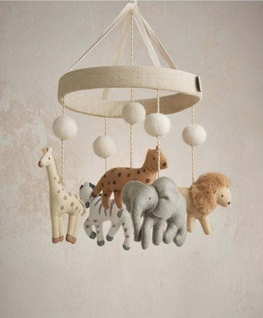 Baby cot mobile with beige fabric drum canopy and hanging plush jungle animals
