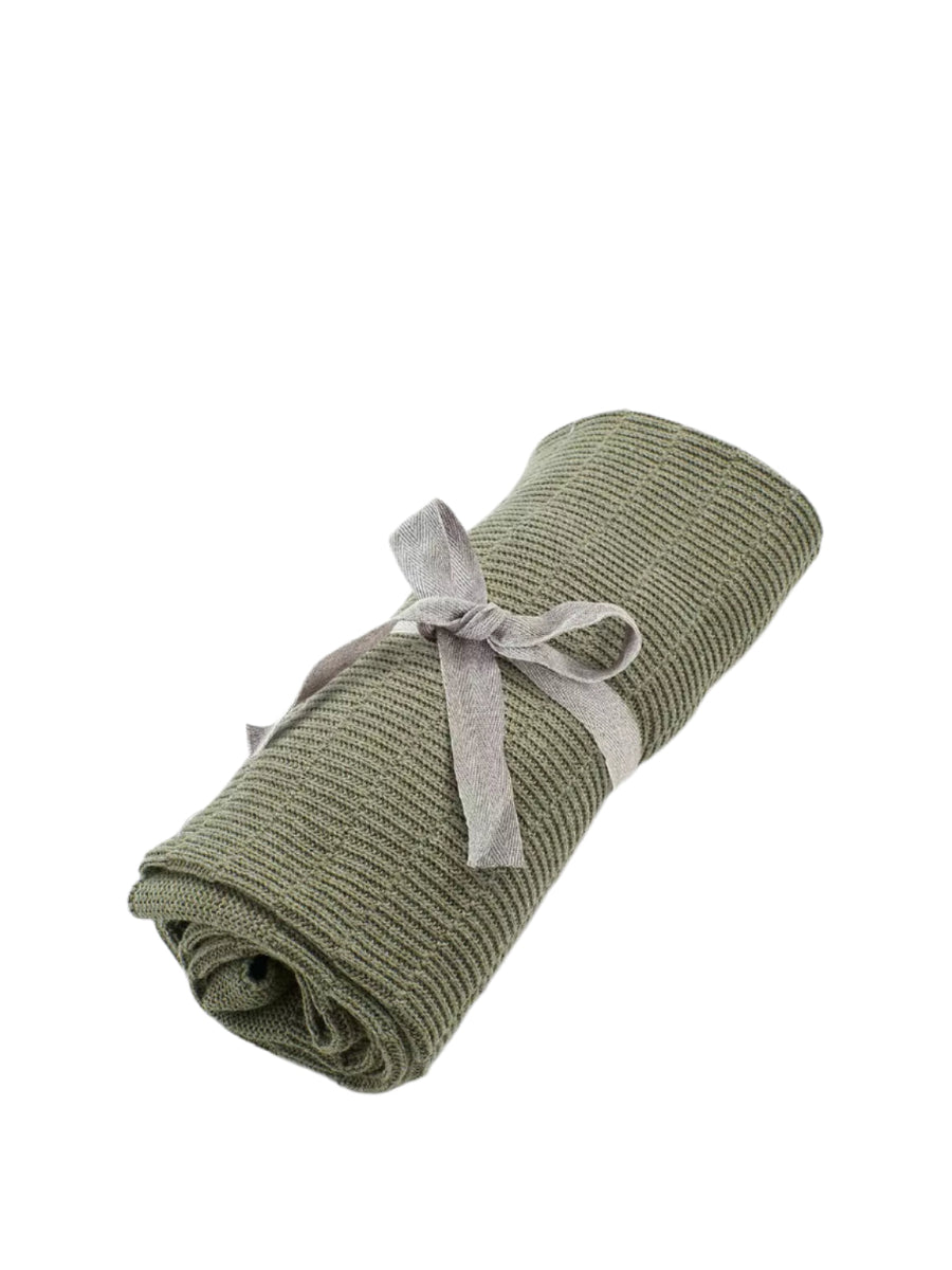 Khaki ribbed knitted blanket with tied fabric bow, rolled