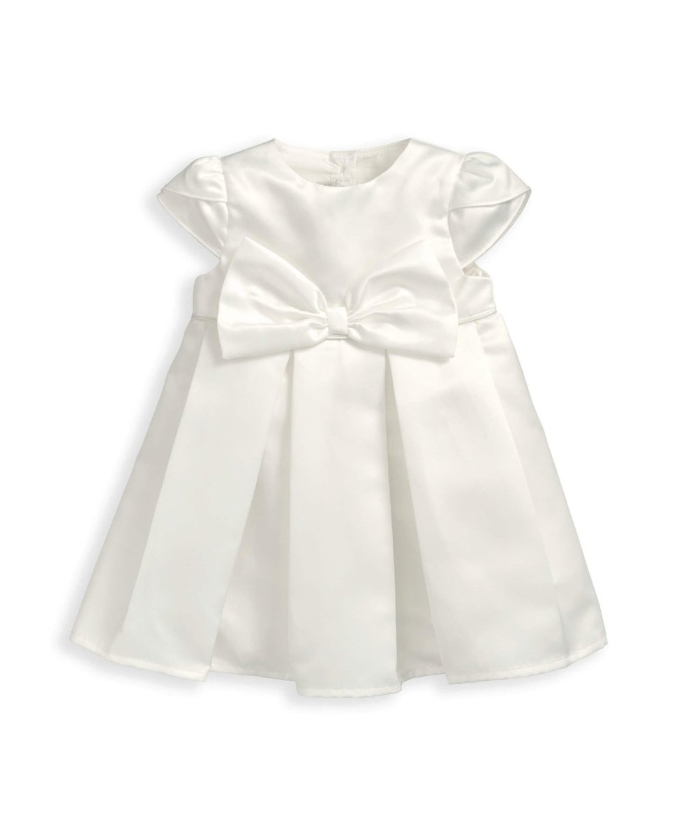 White bow dress with short puff sleeves, gathered waist and pleated skirt