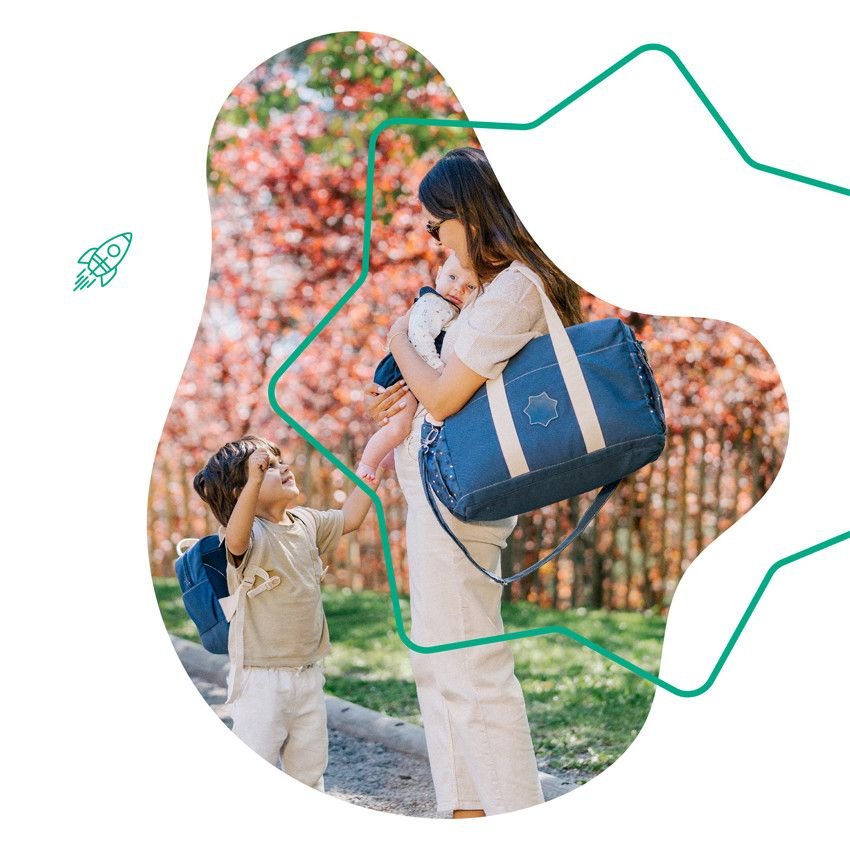 Blue diaper bag crossbody with star emblem and white stripe panels