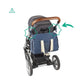 Blue diaper bag clipped to stroller with white stripe panels and star logo