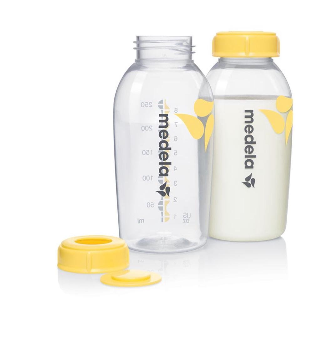 Breast milk bottles, two clear 250ml bottles with yellow lids and one extra cap