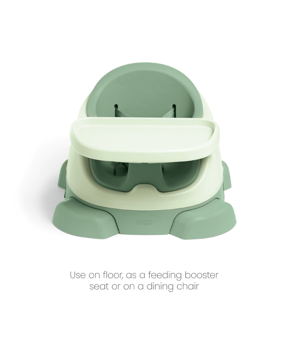Baby booster seat with activity tray, mint green seat and white tray, side view