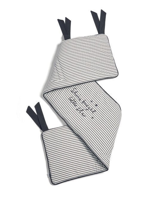 Striped baby bed bumper with tied corners, music notes and star details