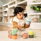 Plush cactus nesting rattle cup with smiling face, plus green and yellow pieces
