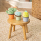 Plush cactus nesting rattle set with green, light blue, and yellow cups