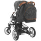 Diaper backpack attached to stroller, black speckle fabric with brown trim and front zip