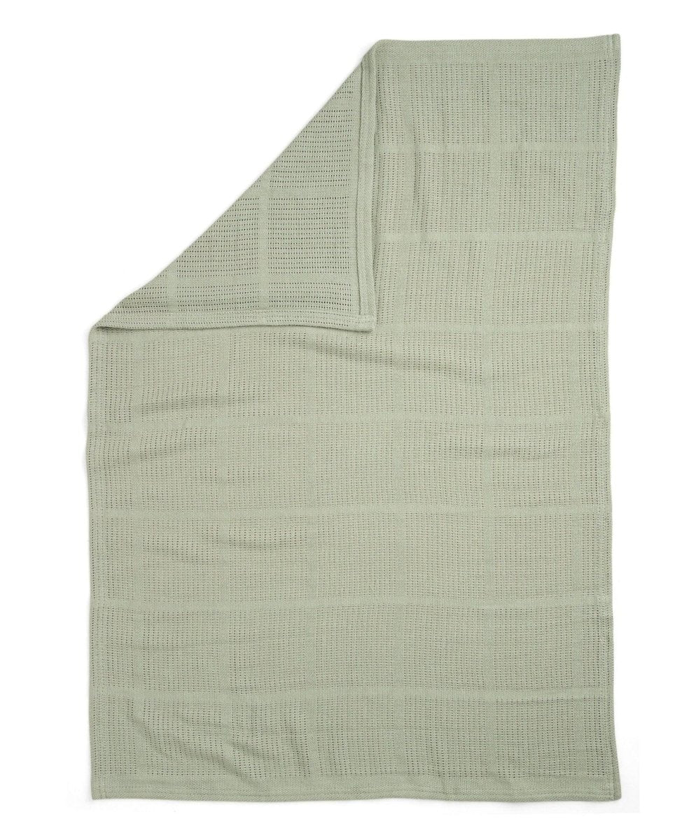 Cellular blanket in sage green, neatly folded with textured pattern