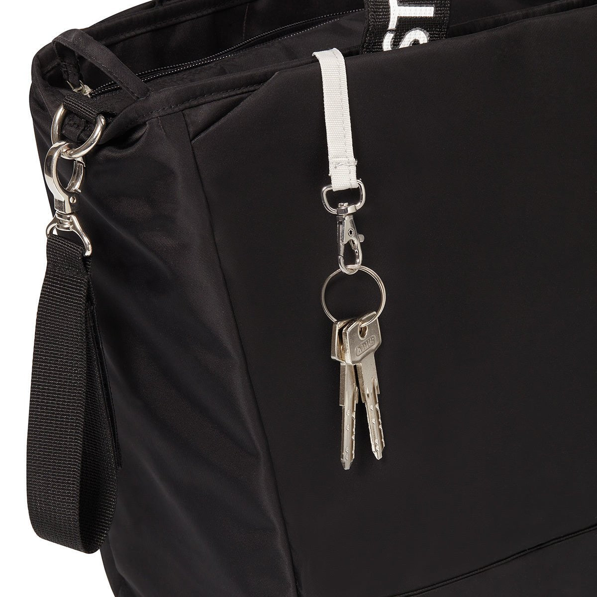 Black changing bag close-up with metal key hook, zipper, and side webbing strap