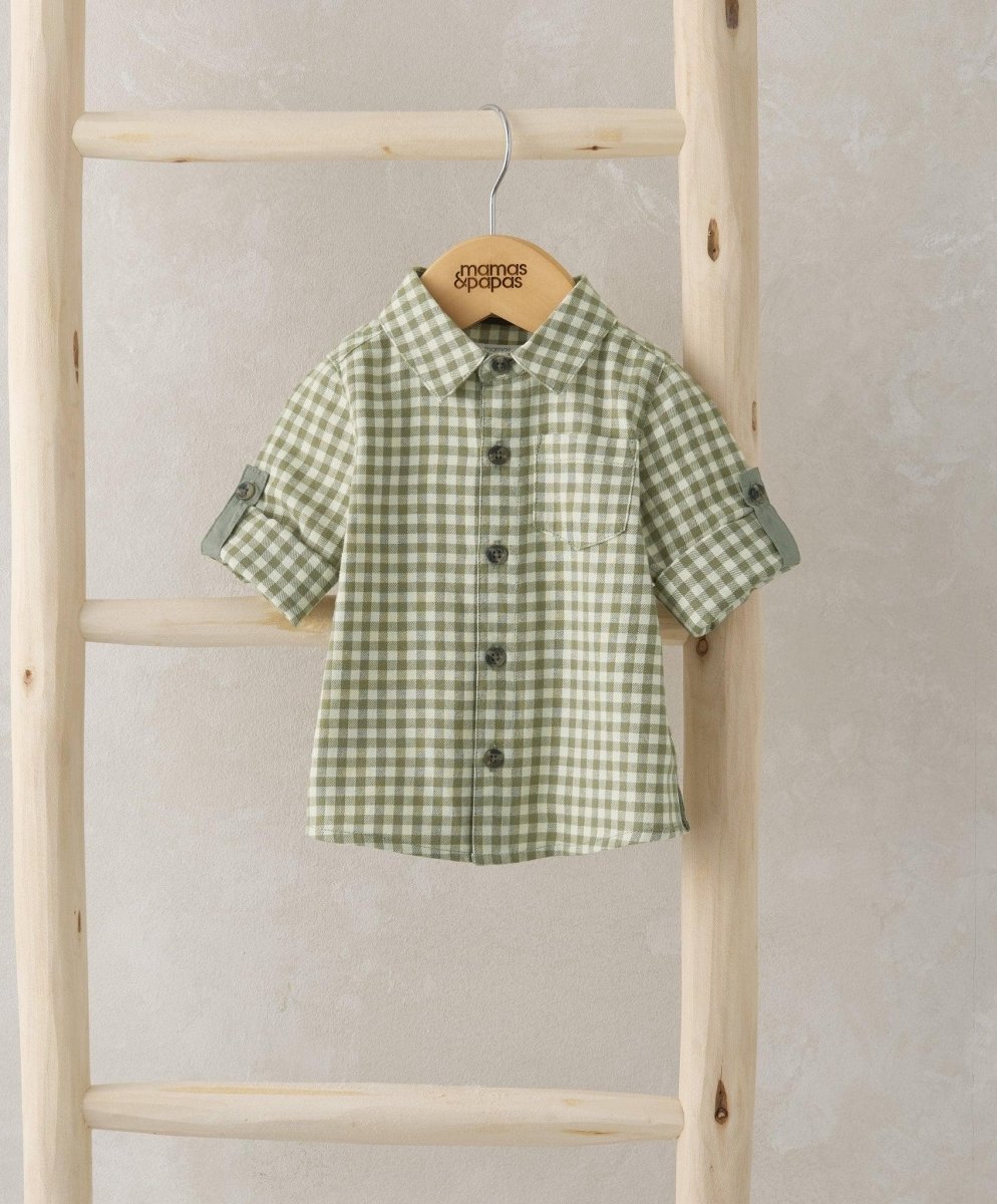 Green-and-white check button-up shirt with short sleeves and front buttons