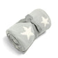 Chenille blanket in light grey with white stars, rolled with bow detail