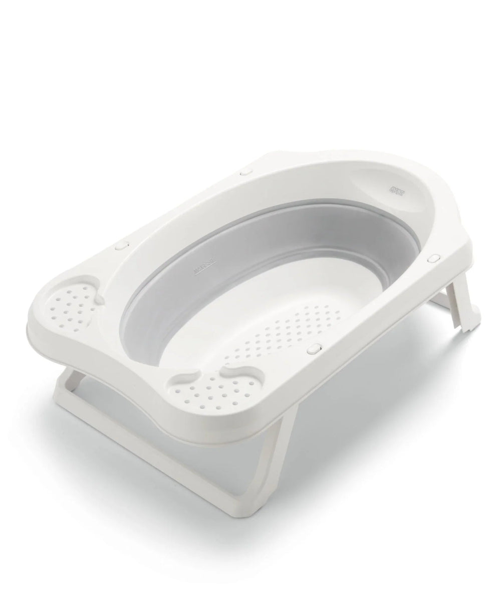 Collapsible baby bath with grey inner tub and perforated support, white frame