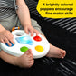 White sensory popper toy with blue light panel and red button, child hands pressing