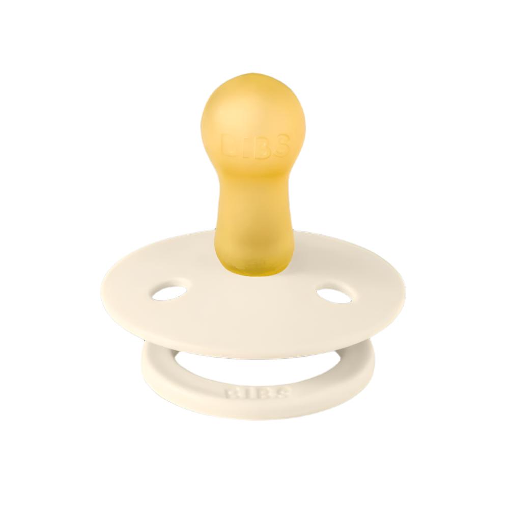 Ivory baby pacifier with round shield and yellow nipple