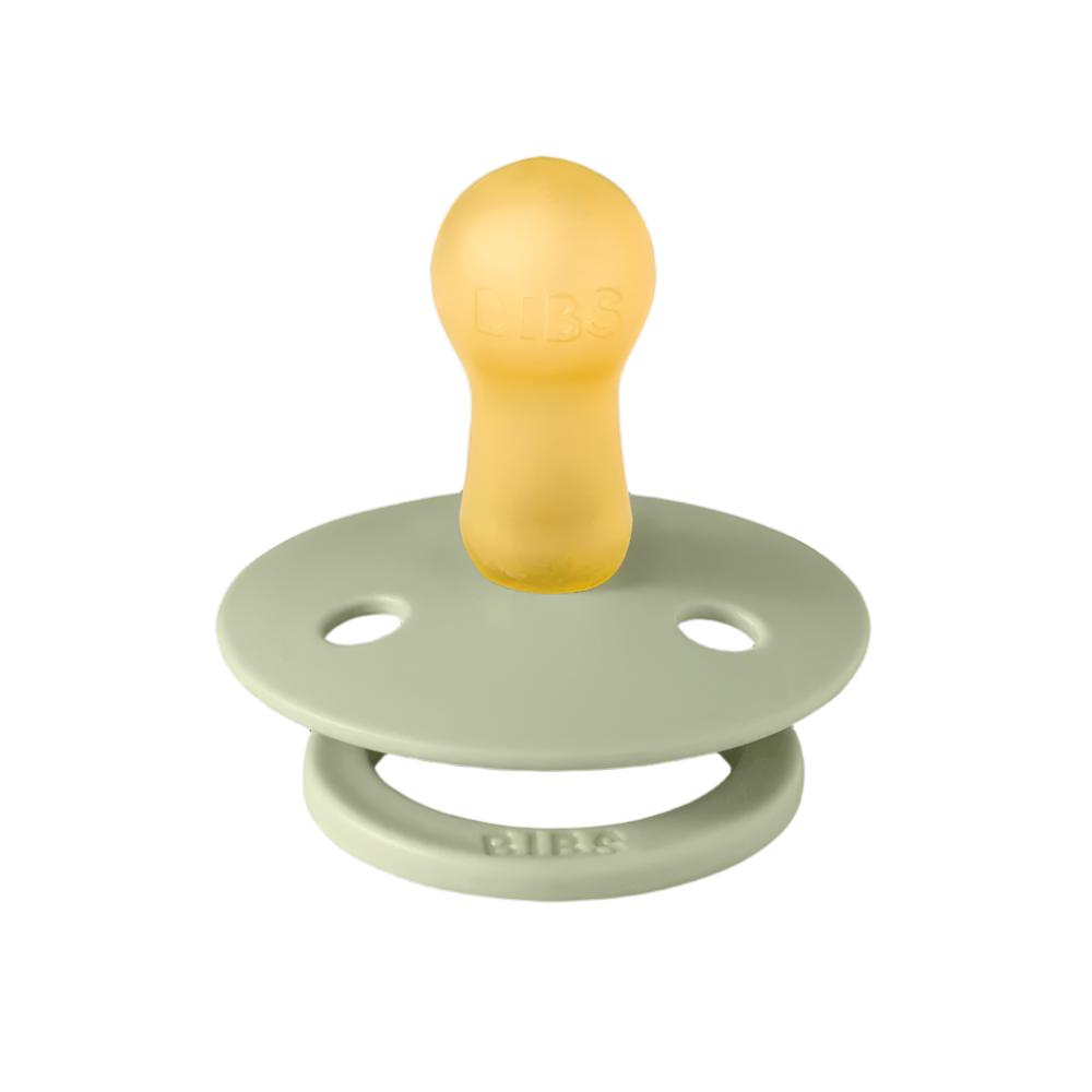 Sage green baby pacifier with round shield and yellow nipple