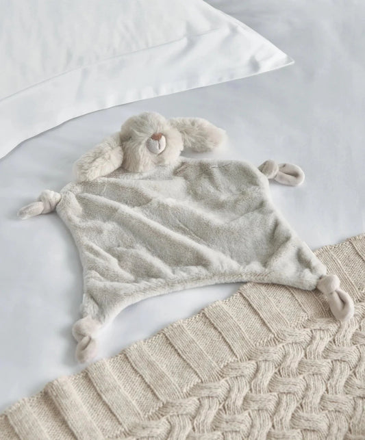 Light grey bunny comforter with plush ears and floppy arms, soft velvety fabric.